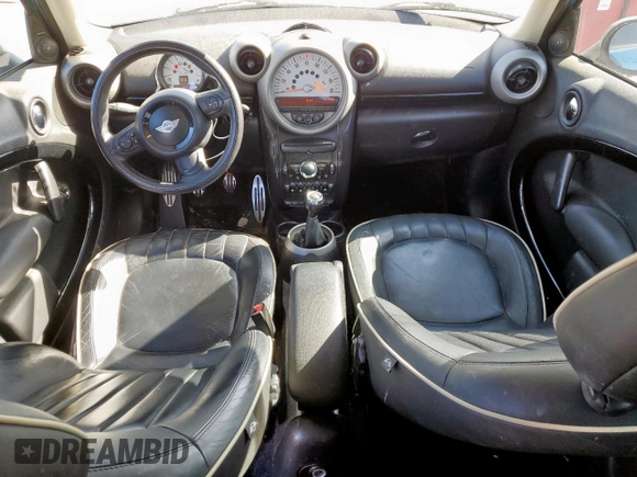 2012 MINI Countryman S with VIN WMWZC3C5XCWM27675, listed as a Copart auction lot 49676205 with 111,499 mi miles and Salvage title. Bid and sale history available at DreamBid. Image 8.