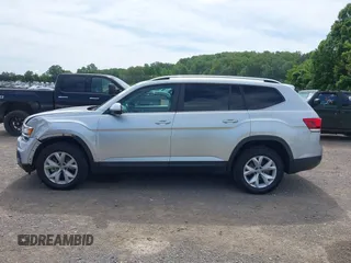 2018 Volkswagen Atlas SE z VIN 1V2DR2CAXJC521412, wystawiony jako IAAI lot #42309661 z przebiegiem 99 045 mil mil oraz . Historia ofert i sprzedaży dostępna na DreamBid. Obrazek 14.