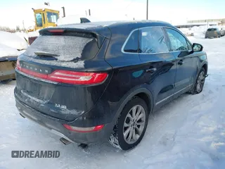 2015 Lincoln MKC with VIN 5LMTJ2AHXFUJ01440, listed as a IAAI auction lot 41526975 with 104,280 mi miles. Bid and sale history available at carsss.com. Image 4.