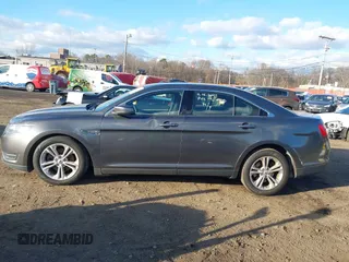 2015 Ford Taurus SEL with VIN 1FAHP2H86FG174102, listed as a IAAI auction lot 40997366 with 132,543 mi miles. Bid and sale history available at carsss.com. Image 14.