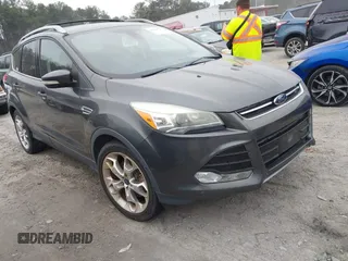 2016 Ford Escape Titanium with VIN 1FMCU9J90GUC26055, listed as a IAAI auction lot 41791735 with 137,233 mi miles. Bid and sale history available at carsss.com. Image 1.