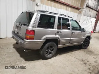 1998 Jeep Grand Cherokee Limited with VIN 1J4GZ88Z1WC289820, listed as a Copart auction lot 88583995 with 245,572 mi miles and Clean Title. Bid and sale history available at carsss.com. Image 3.