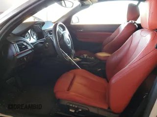 2016 BMW 2 Series 228i with VIN WBA1K9C53GV710823, listed as a Copart auction lot 84087434 with 70,822 mi miles and Salvage Title. Bid and sale history available at carsss.com. Image 7.
