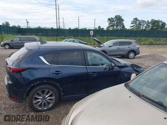 2019 Mazda CX-5 Grand Touring with VIN JM3KFBDM8K1521231, listed as a IAAI auction lot 42738963 with 32,179 mi miles and . Bid and sale history available at DreamBid. Image 13.
