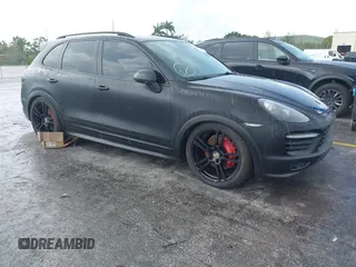 2014 Porsche Cayenne GTS z VIN WP1AD2A28ELA74131, wystawiony jako IAAI lot #42829362 z przebiegiem Nie podano mil oraz . Historia ofert i sprzedaży dostępna na DreamBid. Obrazek 1.