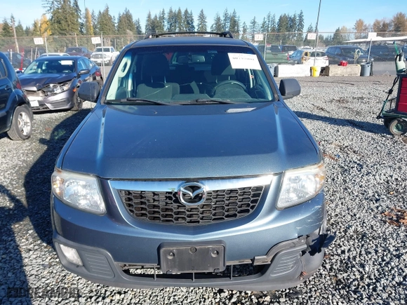 2010 Mazda Tribute Touring with VIN 4F2CY9C73AKM04595, listed as a IAAI auction lot 40797681 with 122,774 mi miles. Bid and sale history available at carsss.com. Image 12.