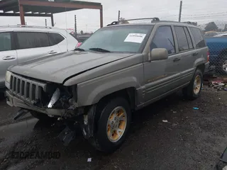 1998 Jeep Grand Cherokee Limited with VIN 1J4GZ78YXWC236969, listed as a IAAI auction lot 41095686 with 182,001 mi miles. Bid and sale history available at carsss.com. Image 2.