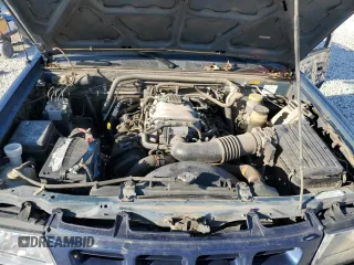 2002 Isuzu Rodeo S with VIN 4S2CK58W124307433, listed as a Copart auction lot 75447074 with 129,163 mi miles and Salvage title. Bid and sale history available at DreamBid. Image 11.