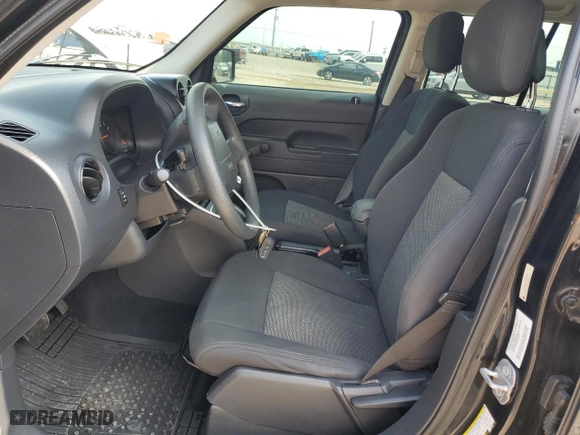 2010 Jeep Patriot Sport with VIN 1J4NT2GA9AD504896, listed as a Copart auction lot 57647304 with 124,864 mi miles and Salvage Title. Bid and sale history available at carsss.com. Image 7.