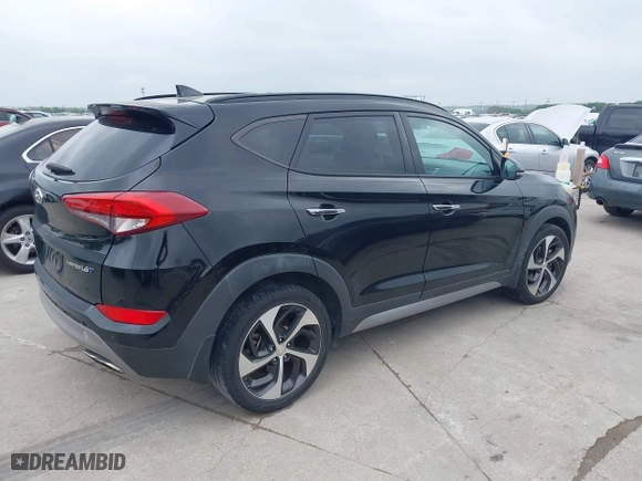 2017 Hyundai Tucson Value with VIN KM8J33A26HU362363, listed as a IAAI auction lot 41940376 with 127,986 mi miles. Bid and sale history available at carsss.com. Image 4.