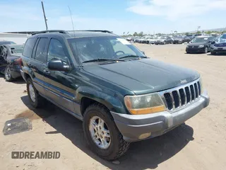 2001 Jeep Grand Cherokee Laredo z VIN 1J4GW48N51C612600, wystawiony jako IAAI lot #42348631 z przebiegiem 165 918 mil mil oraz . Historia ofert i sprzedaży dostępna na DreamBid. Obrazek 1.