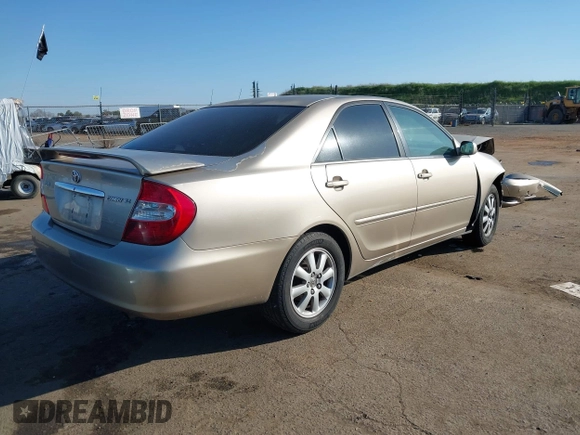2004 Toyota Camry LE with VIN JTDBF32K140154908, listed as a IAAI auction lot 41773923 with 133,028 mi miles. Bid and sale history available at carsss.com. Image 4.
