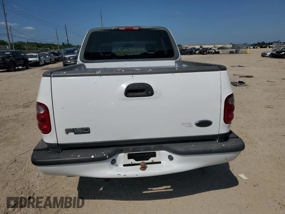2002 Ford F-150 XL with VIN 1FTRX07W52KB08618, listed as a Copart auction lot 57941974 with 172,843 mi miles and Salvage title. Bid and sale history available at DreamBid. Image 6.