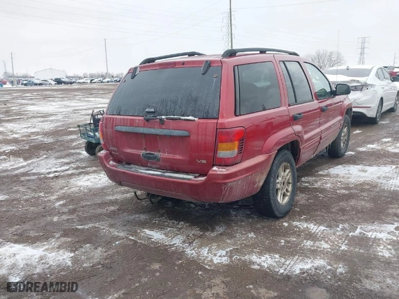 2004 Jeep Grand Cherokee Laredo with VIN 1J4GW48N64C331880, listed as a IAAI auction lot 41618664 with 287,453 mi miles. Bid and sale history available at carsss.com. Image 4.