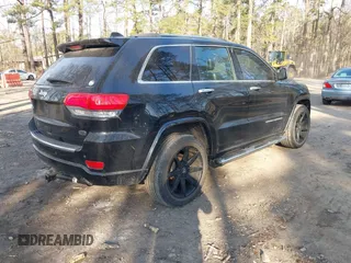 2015 Jeep Grand Cherokee Overland with VIN 1C4RJECGXFC957530, listed as a IAAI auction lot 41633522 with 168,258 mi miles and . Bid and sale history available at DreamBid. Image 4.