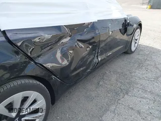 2022 Tesla Model 3 Long Range with VIN 5YJ3E1EB6NF343869, listed as a IAAI auction lot 41826077 with 36,643 mi miles and . Bid and sale history available at DreamBid. Image 6.