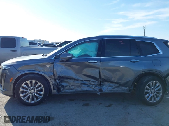 2020 Cadillac XT6 FWD Premium Luxury z VIN 1GYKPCRS8LZ129799, wystawiony jako IAAI lot #41602536 z przebiegiem 96 865 mil mil oraz . Historia ofert i sprzedaży dostępna na DreamBid. Obrazek 14.