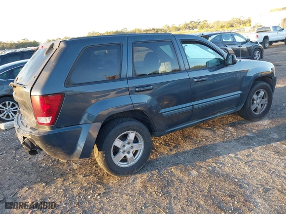 2007 Jeep Grand Cherokee Laredo with VIN 1J8GS48K17C655999, listed as a IAAI auction lot 41590500 with 290,695 mi miles. Bid and sale history available at carsss.com. Image 4.