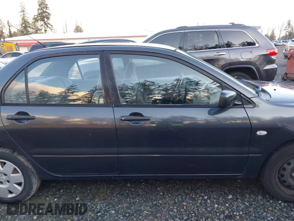 2003 Mitsubishi Lancer ES with VIN JA3AJ26E83U006060, listed as a IAAI auction lot 41254660 with 220,490 mi miles. Bid and sale history available at carsss.com. Image 13.