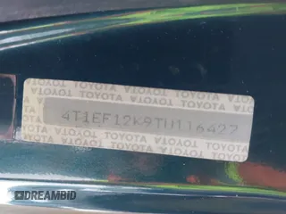 1996 Toyota Camry LE z VIN 4T1EF12K9TU116427, wystawiony jako IAAI lot #38696498 z przebiegiem 242 599 mil mil oraz . Historia ofert i sprzedaży dostępna na DreamBid. Obrazek 9.