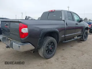 2014 Toyota Tundra SR with VIN 5TFUM5F16EX052444, listed as a IAAI auction lot 42298372 with 121,876 mi miles and . Bid and sale history available at DreamBid. Image 4.