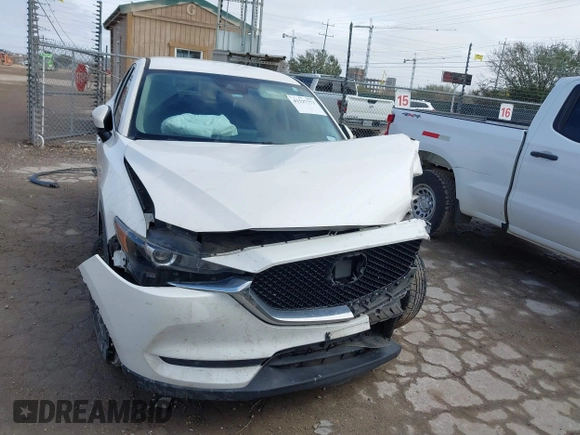 2020 Mazda CX-5 Touring with VIN JM3KFACM9L0771919, listed as a IAAI auction lot 41527773 with 93,417 mi miles and . Bid and sale history available at DreamBid. Image 13.