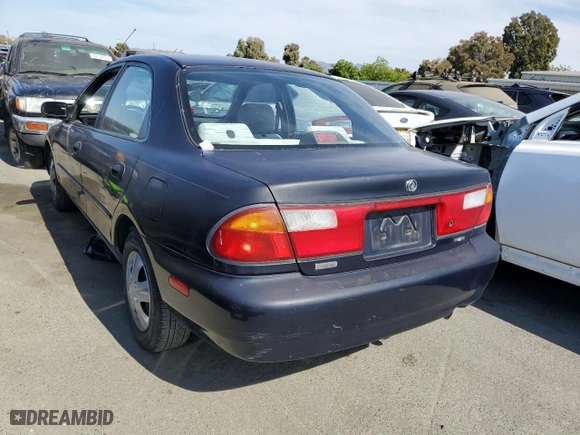 1997 Mazda Protege DX with VIN JM1BC1412V0157268, listed as a Copart auction lot 61380564 with 85,356 mi miles and Salvage Title. Bid and sale history available at carsss.com. Image 2.