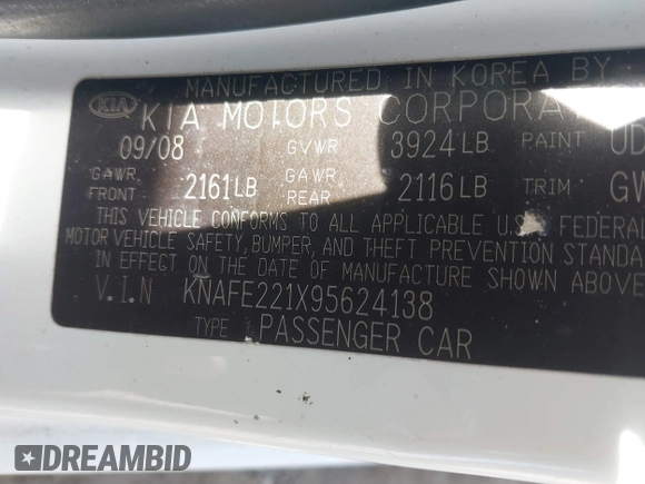 2009 Kia Spectra EX with VIN KNAFE221X95624138, listed as a IAAI auction lot 41823611 with 136,790 mi miles. Bid and sale history available at carsss.com. Image 9.