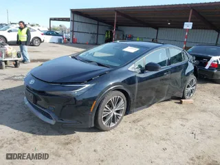 2023 Toyota Prius LE with VIN JTDACAAU9P3013616, listed as a IAAI auction lot 41858354 with 29,414 mi miles. Bid and sale history available at carsss.com. Image 2.