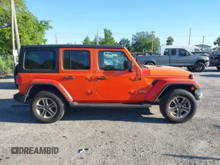 2018 Jeep Wrangler Unlimited Sahara with VIN 1C4HJXEG3JW323634, listed as a IAAI auction lot 41853471 with 126,531 mi miles. Bid and sale history available at carsss.com. Image 13.