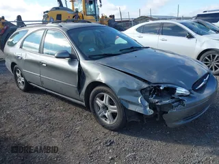2002 Ford Taurus z VIN 1FAHP59SX2G137396, wystawiony jako IAAI lot #41661425 z przebiegiem 155 789 mil mil oraz . Historia ofert i sprzedaży dostępna na DreamBid. Obrazek 1.