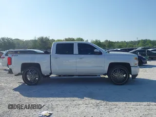 2017 Chevrolet Silverado 1500 LT with VIN 3GCUKREC4HG364108, listed as a IAAI auction lot 42050014 with 148,691 mi miles and . Bid and sale history available at DreamBid. Image 13.