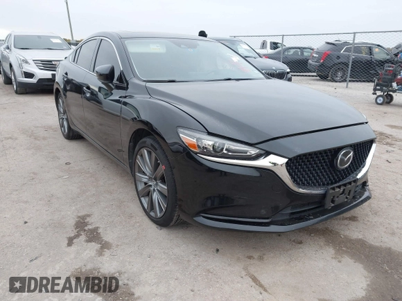 2020 Mazda 6 Grand Touring with VIN JM1GL1TY5L1513949, listed as a IAAI auction lot 40953540 with 55,616 mi miles and . Bid and sale history available at DreamBid. Image 1.