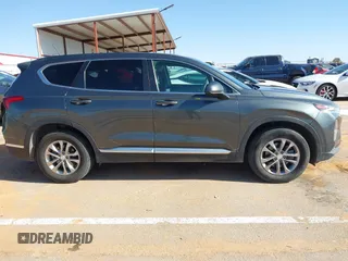 2019 Hyundai Santa Fe SE with VIN 5NMS23AD2KH134016, listed as a IAAI auction lot 41977240 with 61,448 mi miles and . Bid and sale history available at DreamBid. Image 13.
