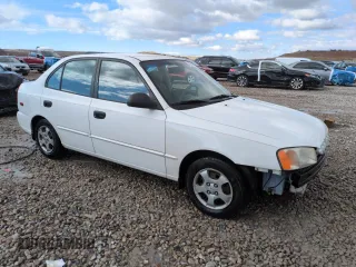 2002 Hyundai Accent GL with VIN KMHCG45C82U358523, listed as a Copart auction lot 48247575 with 164,869 mi miles and Salvage Title. Bid and sale history available at carsss.com. Image 4.