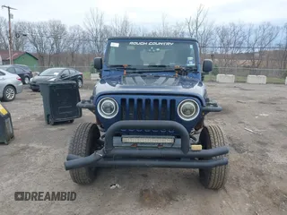 2004 Jeep Wrangler X with VIN 1J4FA39S64P780915, listed as a IAAI auction lot 42035524 with 131,057 mi miles. Bid and sale history available at carsss.com. Image 12.