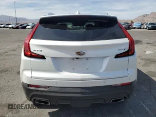 2023 Cadillac XT4 FWD Luxury with VIN 1GYAZAR46PF134602, listed as a Copart auction lot 54684865 with 13,221 mi miles and Salvage title. Bid and sale history available at DreamBid. Image 6.