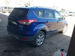 2016 Ford Escape Titanium with VIN 1FMCU9JXXGUB58961, listed as a IAAI auction lot 41772977 with 122,665 mi miles. Bid and sale history available at carsss.com. Image 4.