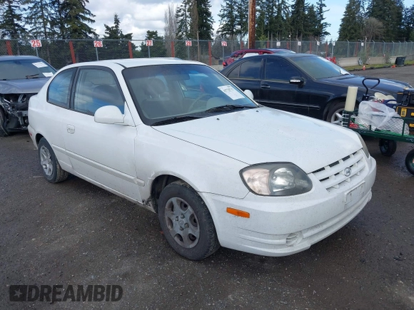 2004 Hyundai Accent GL with VIN KMHCG35C74U303431, listed as a IAAI auction lot 41725717 with 211,893 mi miles. Bid and sale history available at carsss.com. Image 1.