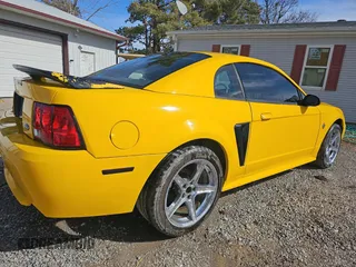 1999 Ford Mustang GT with VIN 1FAFP42X6XF150053, listed as a Copart auction lot 46870155 with 158,434 mi miles and Clean Title. Bid and sale history available at carsss.com. Image 4.
