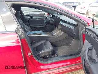 2021 Tesla Model S Plaid with VIN 5YJSA1E60MF447203, listed as a IAAI auction lot 42025120 with 58,190 mi miles. Bid and sale history available at carsss.com. Image 5.