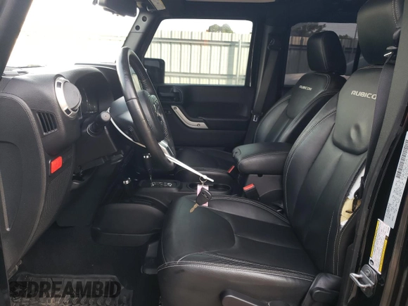2016 Jeep Wrangler Unlimited Rubicon with VIN 1C4HJWFG9GL220687, listed as a Copart auction lot 60552705 with 49,525 mi miles and Salvage title. Bid and sale history available at DreamBid. Image 7.