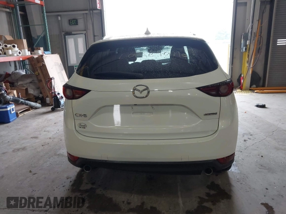 2020 Mazda CX-5 Grand Touring with VIN JM3KFADMXL0742038, listed as a IAAI auction lot 42292400 with 68,339 mi miles and . Bid and sale history available at DreamBid. Image 17.