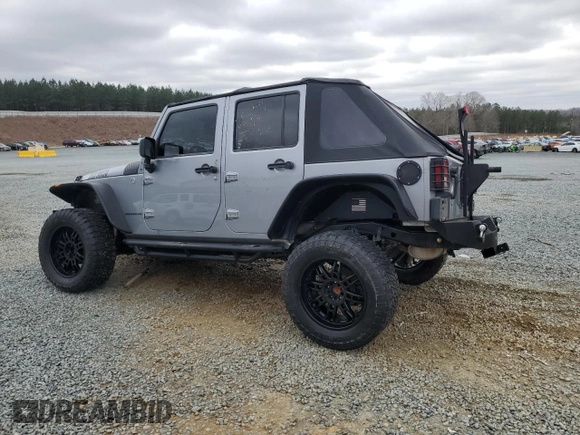 2014 Jeep Wrangler Unlimited Rubicon with VIN 1C4BJWFG7EL197252, listed as a Copart auction lot 44798205 with 115,778 mi miles and Salvage Title. Bid and sale history available at carsss.com. Image 2.