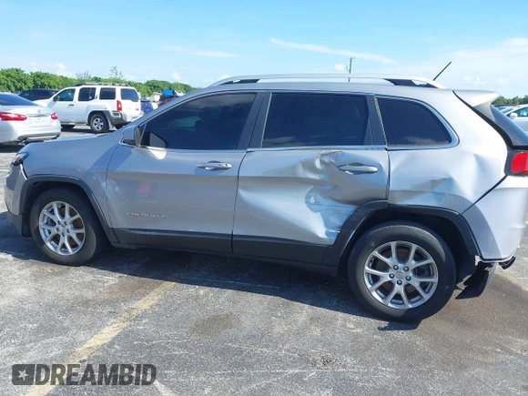 2014 Jeep Cherokee Latitude with VIN 1C4PJLCS6EW103423, listed as a IAAI auction lot 40118289 with 112,120 mi miles and . Bid and sale history available at DreamBid. Image 18.