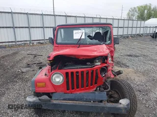 1997 Jeep Wrangler Sport z VIN 1J4FY19S2VP426553, wystawiony jako IAAI lot #41917764 z przebiegiem 154 140 mil mil oraz . Historia ofert i sprzedaży dostępna na DreamBid. Obrazek 12.