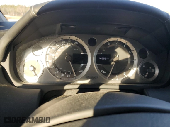 2014 Aston Martin Vantage z VIN SCFEKBBK3EGD18661, wystawiony jako Copart lot #86366204 z przebiegiem 14 863 mil mil oraz Szkoda całkowita • Salvage title. Historia ofert i sprzedaży dostępna na DreamBid. Obrazek 9.