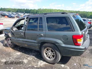 2004 Jeep Grand Cherokee Laredo with VIN 1J4GX48S34C192181, listed as a IAAI auction lot 42320368 with 181,415 mi miles and . Bid and sale history available at DreamBid. Image 14.