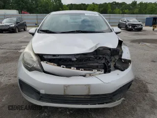 2013 Kia Rio LX z VIN KNADM4A35D6280066, wystawiony jako Copart lot #57293585 z przebiegiem 129 281 mil mil oraz Szkoda całkowita • Salvage title. Historia ofert i sprzedaży dostępna na DreamBid. Obrazek 5.