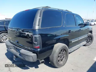 2004 Chevrolet Tahoe LS with VIN 1GNEC13T94J331286, listed as a IAAI auction lot 40691697 with 211,544 mi miles. Bid and sale history available at carsss.com. Image 4.